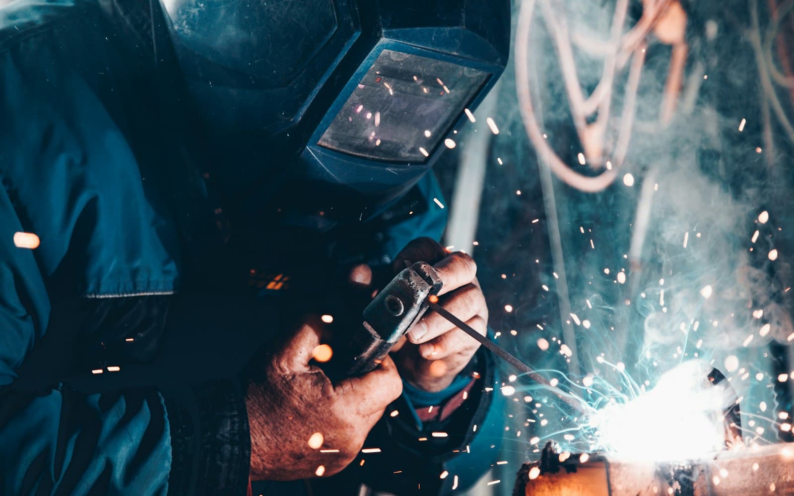 Factory worker operating machinery